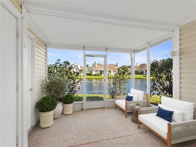 sunroom with a water view