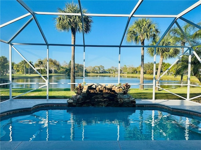 view of swimming pool featuring a water view, a yard, and a lanai