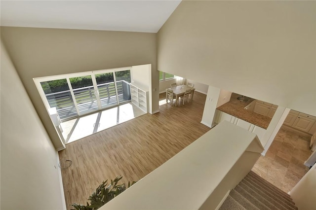 stairway with high vaulted ceiling