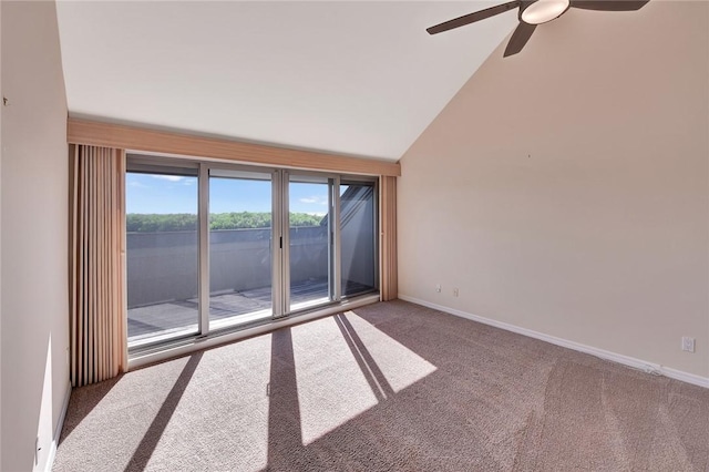 carpeted spare room featuring high vaulted ceiling