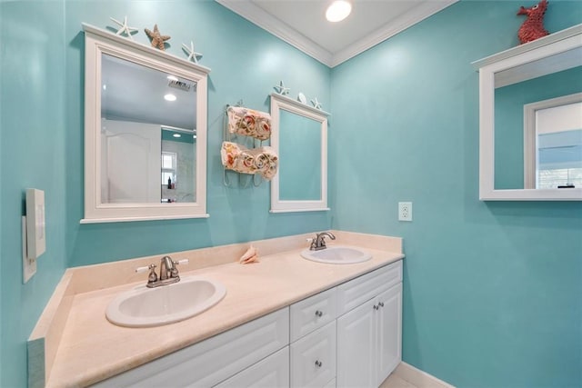 bathroom with ornamental molding and vanity