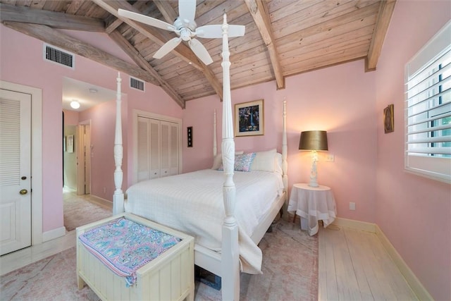 bedroom featuring wooden ceiling, baseboards, and wood-type flooring