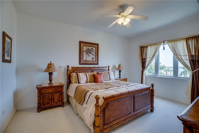 bedroom with light carpet and ceiling fan