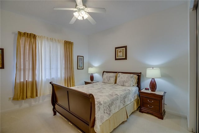 bedroom with light colored carpet and ceiling fan