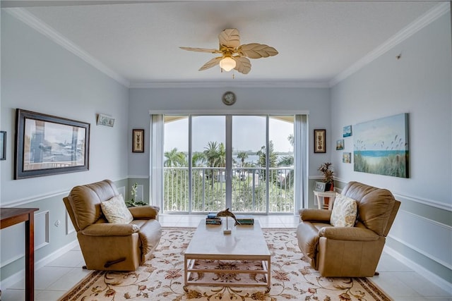 tiled living room featuring ceiling fan and ornamental molding