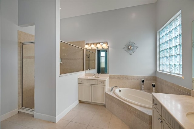 bathroom with vanity, plus walk in shower, and tile patterned flooring