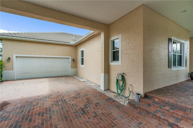 view of side of home with a garage