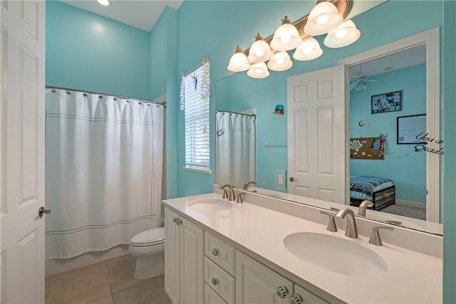 bathroom with vanity, a shower with curtain, tile patterned floors, and toilet