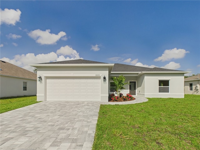 view of front of property with a garage, a front yard, stucco siding, and decorative driveway