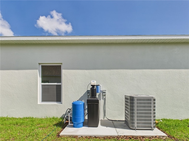 details with central AC and stucco siding