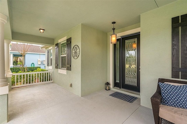 entrance to property with covered porch