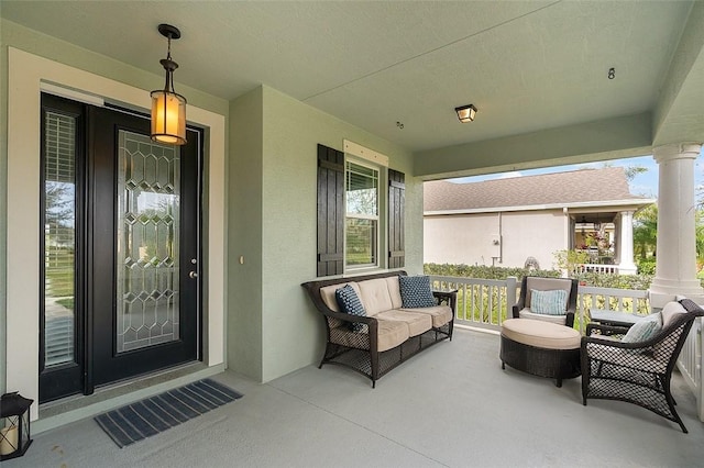 view of exterior entry with a porch