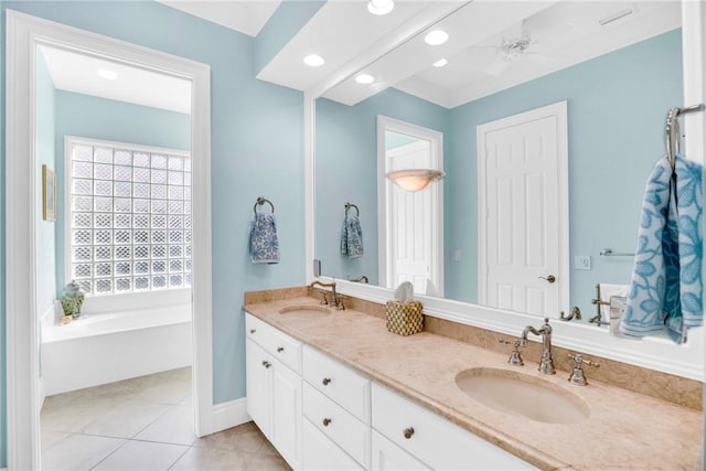 full bathroom with a garden tub, double vanity, tile patterned flooring, and a sink