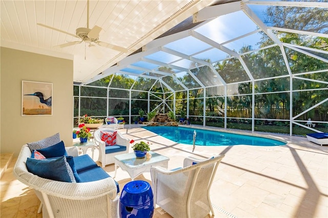 pool featuring a patio, a lanai, and a ceiling fan