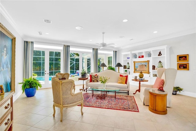 tiled living room featuring crown molding, ceiling fan, and french doors