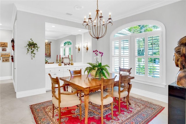 dining space with a notable chandelier, light tile patterned floors, baseboards, and crown molding