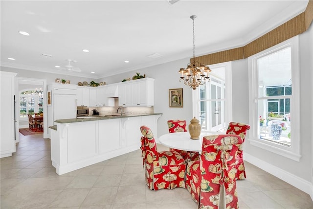 dining room with crown molding, a notable chandelier, light tile patterned floors, recessed lighting, and baseboards