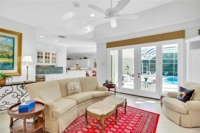 living room featuring light tile patterned floors, recessed lighting, beverage cooler, visible vents, and french doors