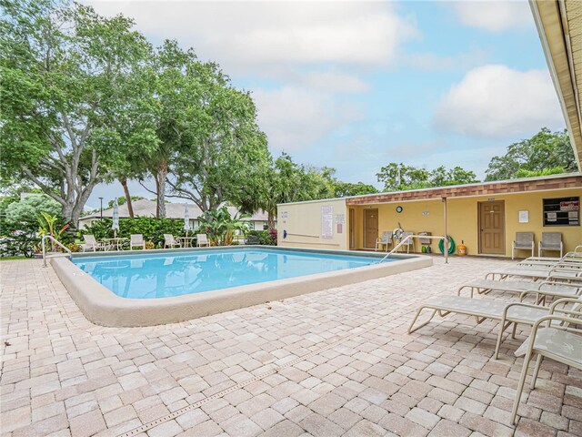 view of swimming pool featuring a patio