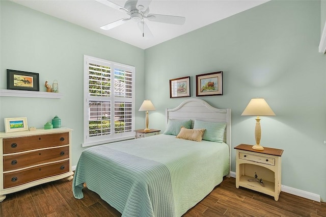 bedroom with baseboards, wood finished floors, and a ceiling fan