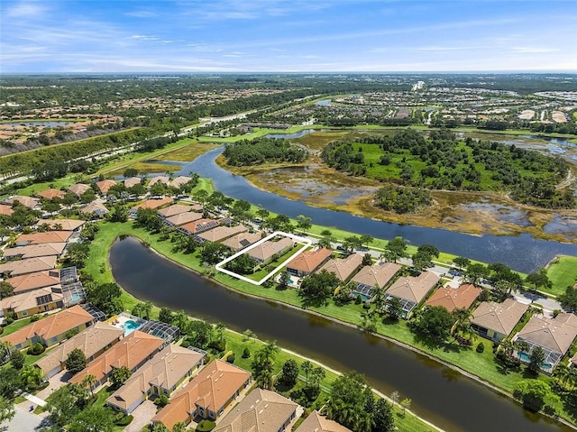 birds eye view of property featuring a water view and a residential view
