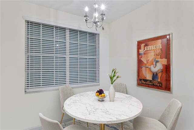 5540 N Harbor Village Dr Unit 204, Vero Beach, FL 32967 - dining area with a chandelier and baseboards