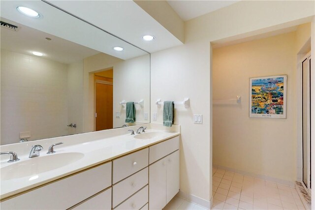5540 N Harbor Village Dr Unit 204, Vero Beach, FL 32967 - full bathroom featuring double vanity, recessed lighting, and tile patterned floors