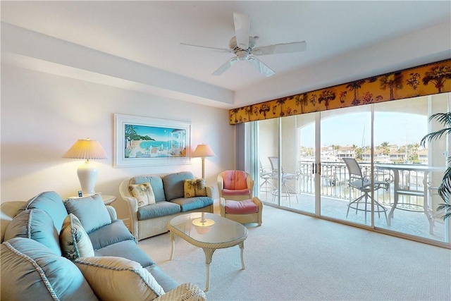 living room featuring carpet flooring and ceiling fan