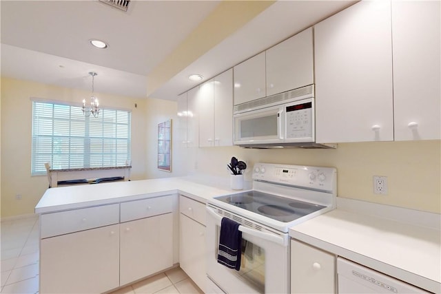 kitchen with white cabinets, kitchen peninsula, pendant lighting, white appliances, and light tile patterned flooring