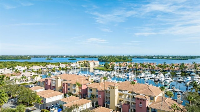 birds eye view of property with a water view