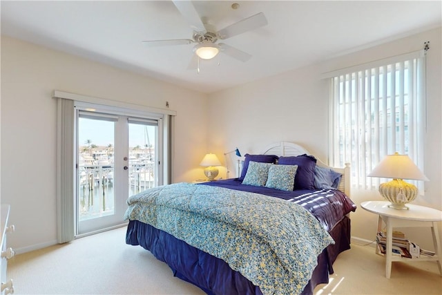 carpeted bedroom featuring access to outside and ceiling fan