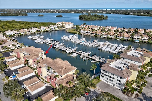 birds eye view of property featuring a water view