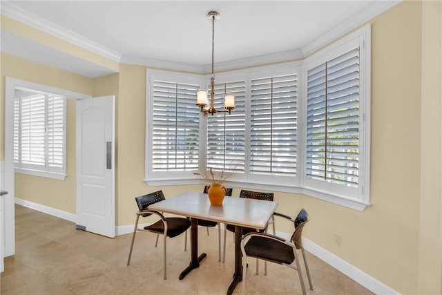 dining area with a notable chandelier, baseboards, and ornamental molding