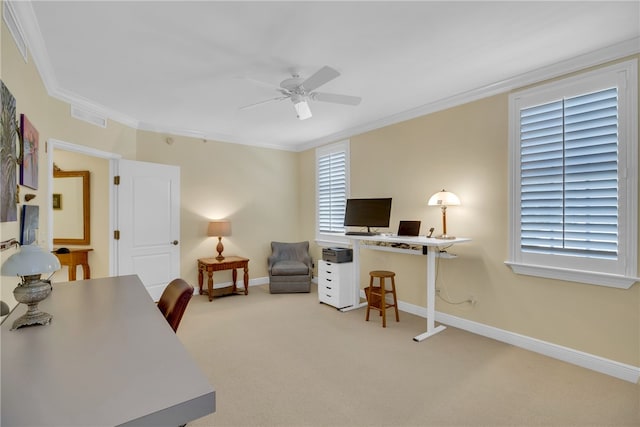 carpeted office featuring visible vents, baseboards, ornamental molding, and a ceiling fan