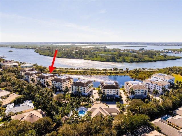 drone / aerial view with a water view and a residential view