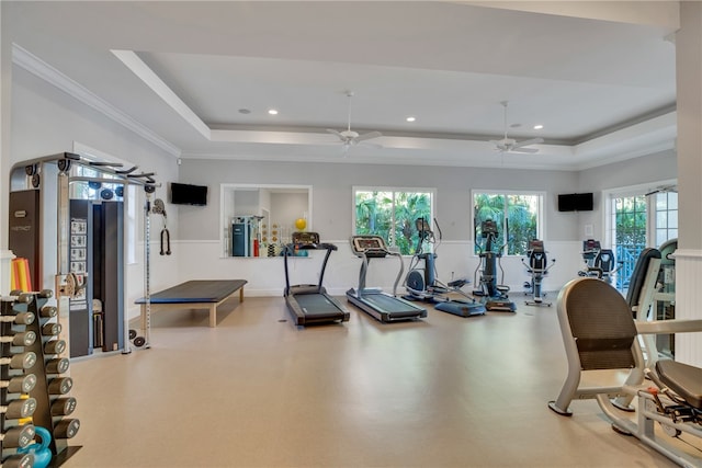 gym featuring recessed lighting, a raised ceiling, ceiling fan, and ornamental molding