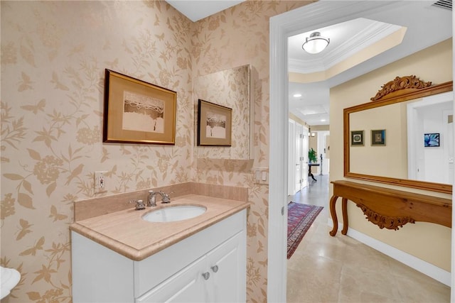 bathroom with wallpapered walls, vanity, baseboards, and ornamental molding