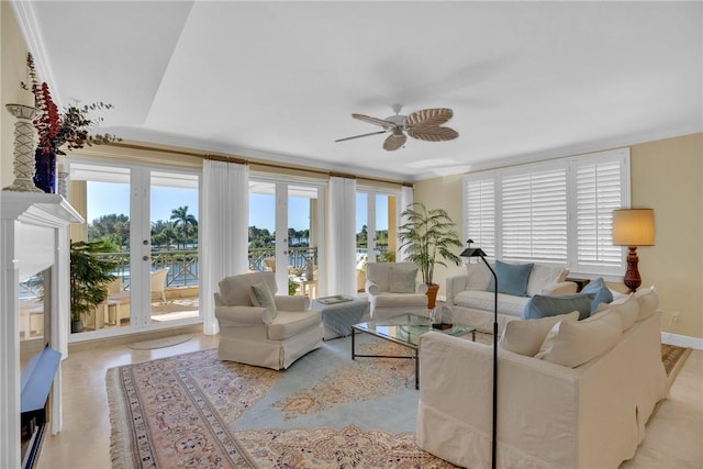 living room with french doors, baseboards, and ceiling fan