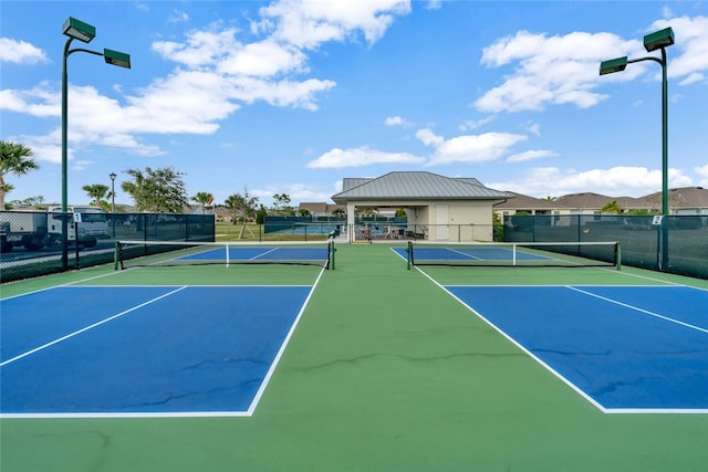 view of sport court featuring fence