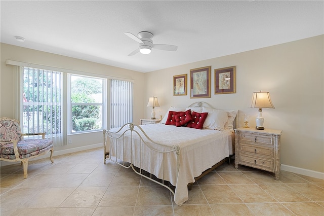 bedroom featuring light tile patterned flooring and ceiling fan