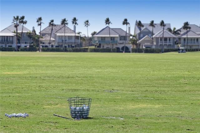 view of property's community featuring a lawn