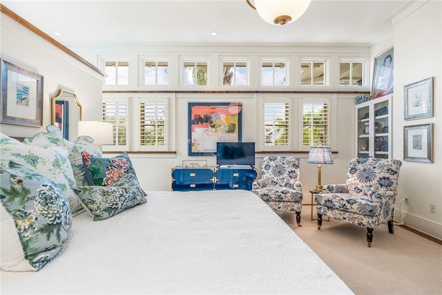 bedroom featuring carpet and crown molding