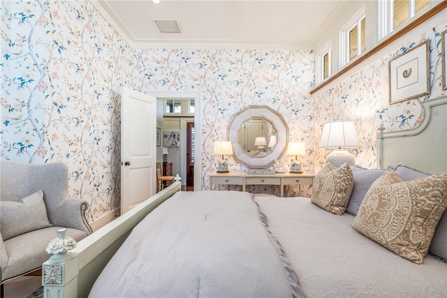 bedroom featuring crown molding