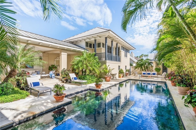 rear view of property featuring a patio