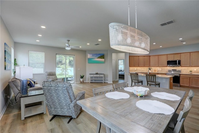 240 Barbossa Dr, Sebastian, FL 32958 - dining room featuring light wood-style floors, recessed lighting, and ceiling fan