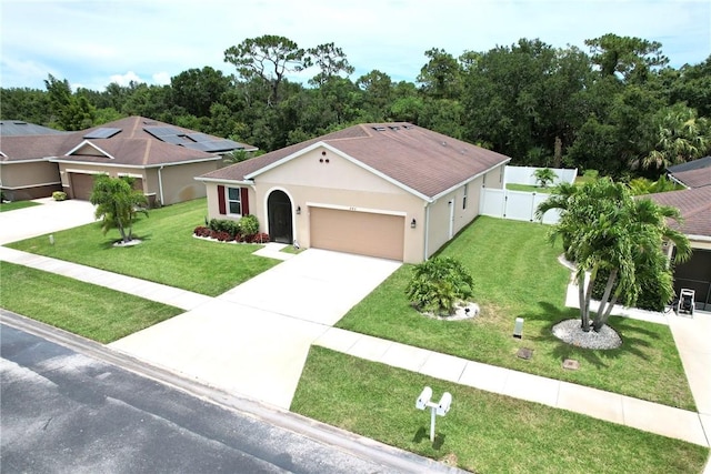 240 Barbossa Dr, Sebastian, FL 32958 - view of front of house featuring an attached garage, concrete driveway, stucco siding, and a shingled roof