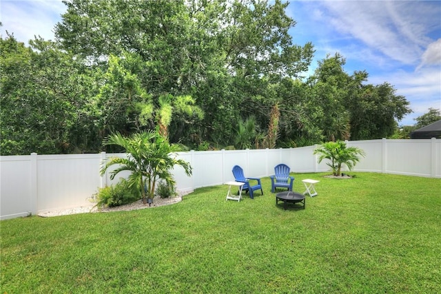 240 Barbossa Dr, Sebastian, FL 32958 - fenced backyard featuring a fire pit