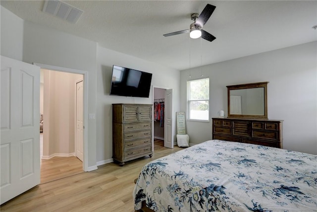 240 Barbossa Dr, Sebastian, FL 32958 - bedroom with light wood-style flooring, a walk in closet, a ceiling fan, and a closet