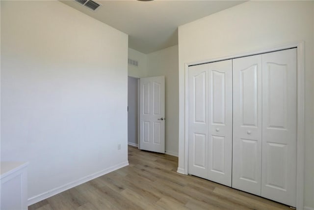240 Barbossa Dr, Sebastian, FL 32958 - unfurnished bedroom featuring light wood finished floors and a closet