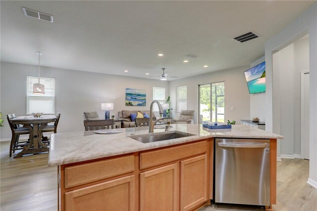 240 Barbossa Dr, Sebastian, FL 32958 - kitchen featuring dishwasher, open floor plan, light wood-style flooring, light stone countertops, and ceiling fan